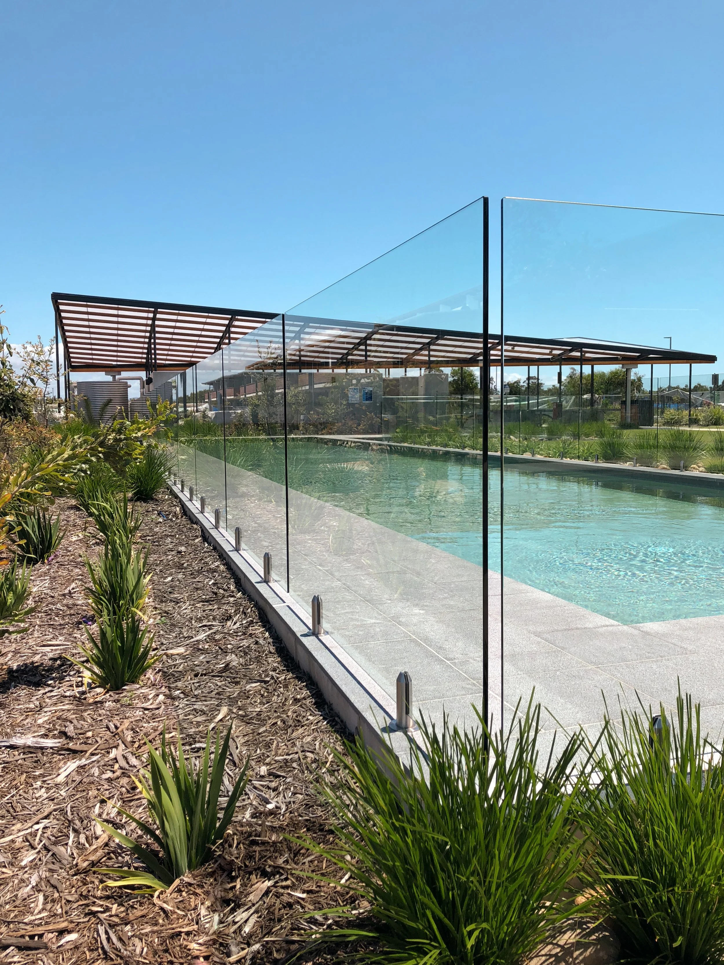 Custom made frameless glass pool fencing, designed and installed by Secure Fit Fencing, Perth
