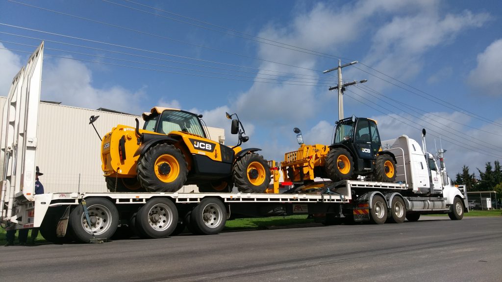 Yellow Hire Telehandlers on truck