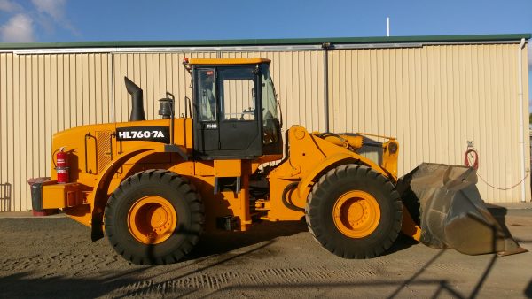 Yellow Hire front loader Side